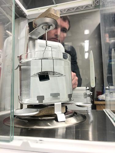 营 employees measuring the specific gravity of a wax fuel 2